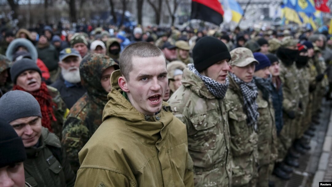 Members of self-defense battalions take part in a rally to commemorate demonstrators who were killed during the Maidan protests in 2014 in Kiev, Ukraine, Feb. 20, 2016.