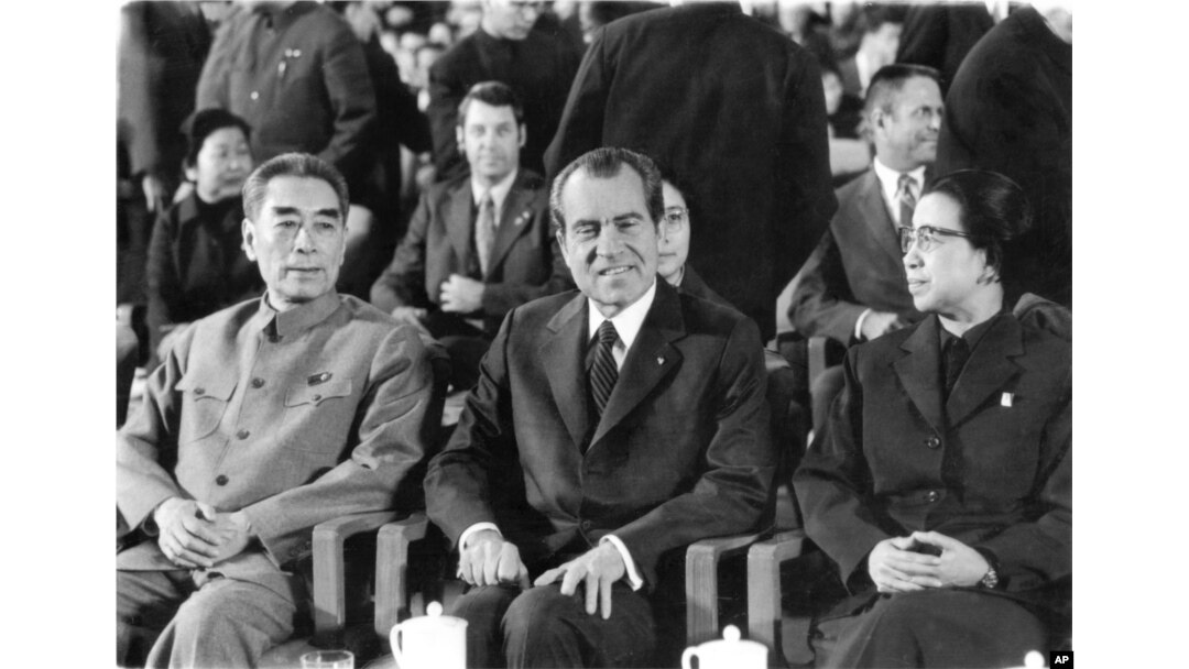 FILE - President Nixon sits between Chinese Premier Chou En-lai and Chiang Ching, wife of Chairman Mao Tse-tung, at a cultural show in the Great Hall of the People, Feb. 22, 1972 in Peking as an interlude in the talks between the two countries leaders.