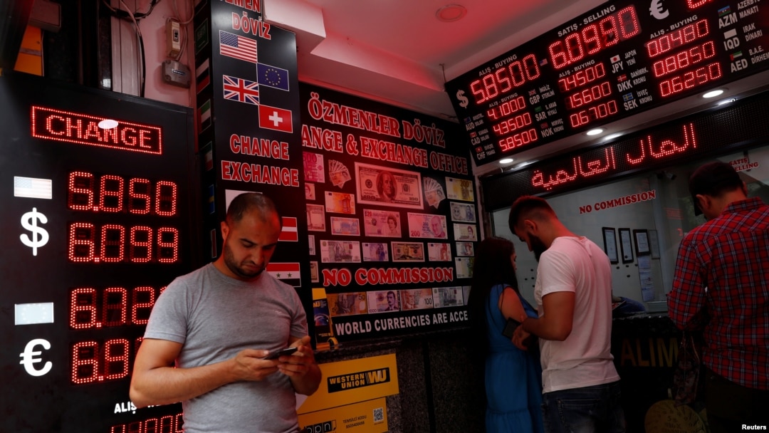 People change money at a currency exchange office in Istanbul, Turkey, Aug. 17, 2018.