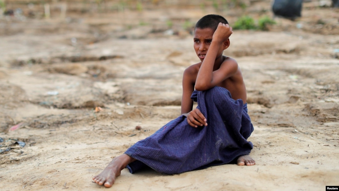 A Rohingya refugee boy sits on the ground at Tang Khali refugee camp near Cox's Bazar, Bangladesh, Oct. 18, 2017. 