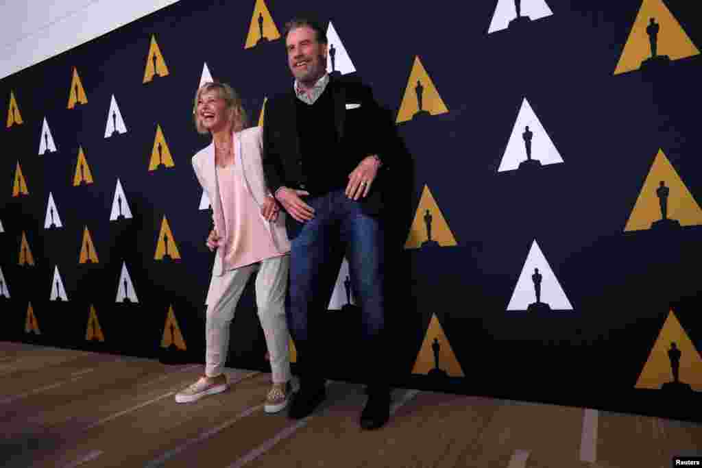 Cast members John Travolta and Olivia Newton-John dance at a 40th anniversary screening of &quot;Grease&quot; at the Academy of Motion Picture Arts and Sciences in Beverly Hills, California, Aug. 15, 2018.
