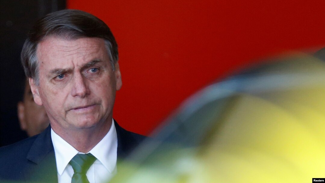 Brazil's President-elect Jair Bolsonaro leaves the transition government building in Brasilia, Dec. 11, 2018.