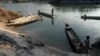Fishermen prepare to launch from Don Khone. The Laos government is planning a $600 million dam for the area but has been reluctant to reveal details surrounding the proposal and the impact it will have on fish migration and fish stocks. (Luke Hunt for VOA