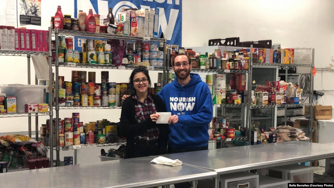 David Joffee from Nourish Now poses with Bella Berrellez. Nourish Now is a nonprofit organization that collects food from donors like restaurants and cafeterias and distributes it to families in need. 