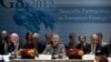 British Foreign Minister William Hague (L) and French Foreign Minister Laurent Fabius (R) listen as U.S. Secretary of State Hillary Clinton speaks during the G8 Deauville Partnership with Arab Countries in Transition meeting in New York, September 28, 201