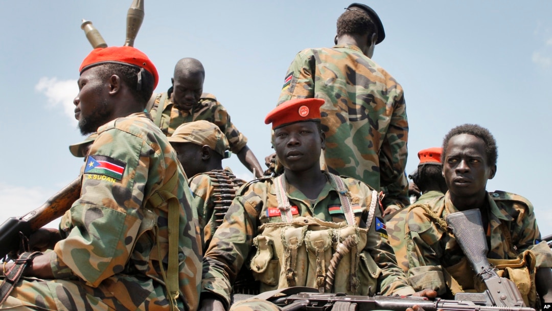 FILE - A group of South Sudanese government soldiers sit on the back of a pickup truck in Malakal, South Sudan, Oct. 16, 2016.