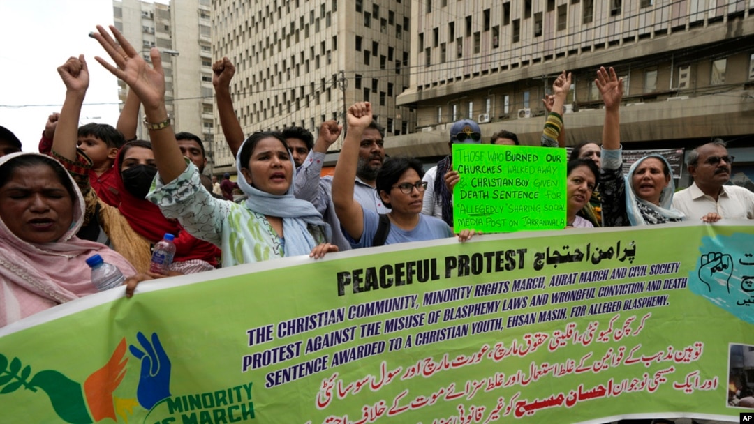 FILE - Members from Pakistan's minority community and civil society chant slogans during a demonstration against the conviction of a Christian man on charges of blasphemy and condemn the country's blasphemy laws, July 2, 2024. 