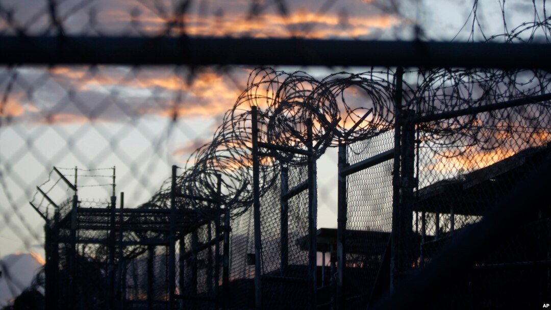 FILE - Dawn arrives at the now-closed Camp X-Ray, which was used as the first detention facility for al-Qaida and Taliban militants who were captured after the Sept. 11 attacks, at the Guantanamo Bay Naval Base, Cuba. The Obama administration is transferr