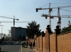 FILE - Construction cranes tower over the Rosebank suburb of Johannesburg, South Africa, Sept. 4, 2018.