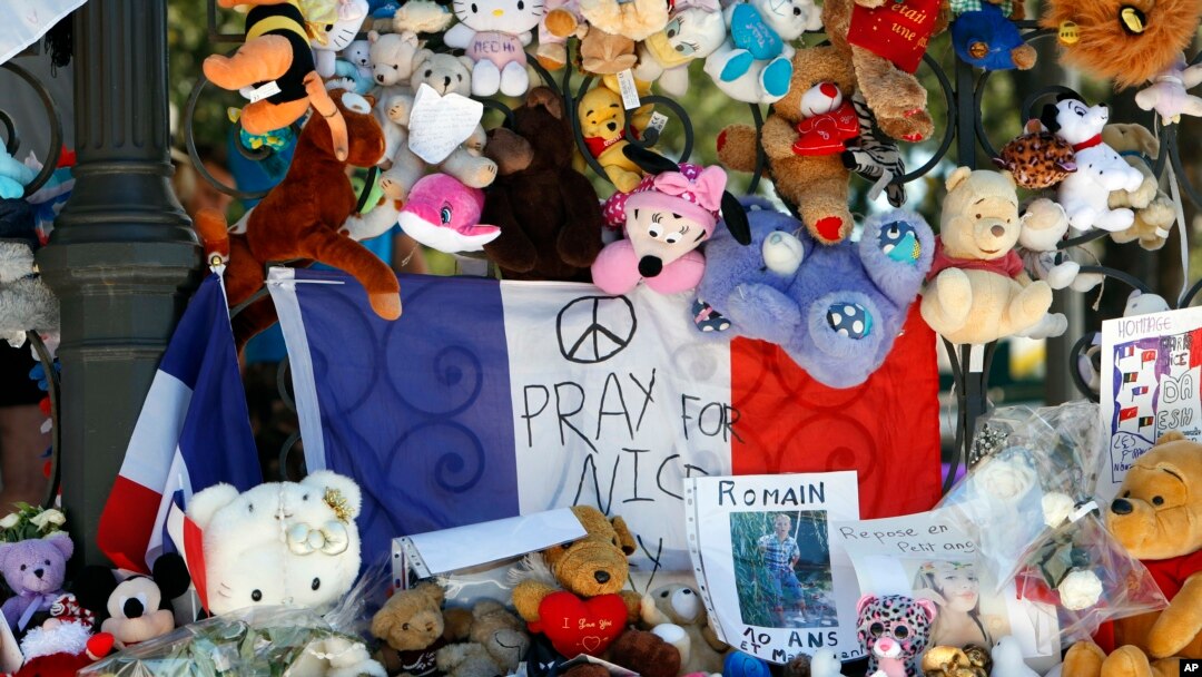 Dolls and teddy bears are placed at a memorial in a gazebo on the Promenade des Anglais in Nice, southern France on July 20, 2016.