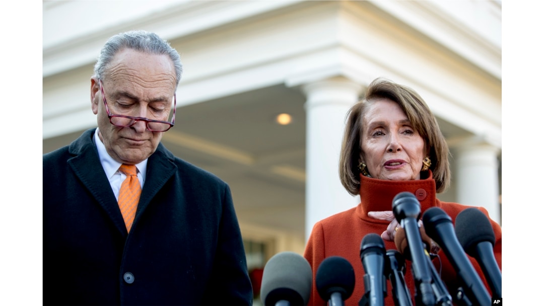 FILE - House Minority Leader Nancy Pelosi of California, right, accompanied by Senate Minority Leader Sen. Chuck Schumer of New York, speaks to members of the media outside the West Wing of the White House in Washington, Dec. 11, 2018.
