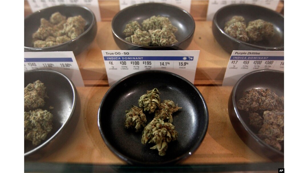 Different types of marijuana sit on display at Harborside marijuana dispensary, Jan. 1, 2018, in Oakland, Calif.