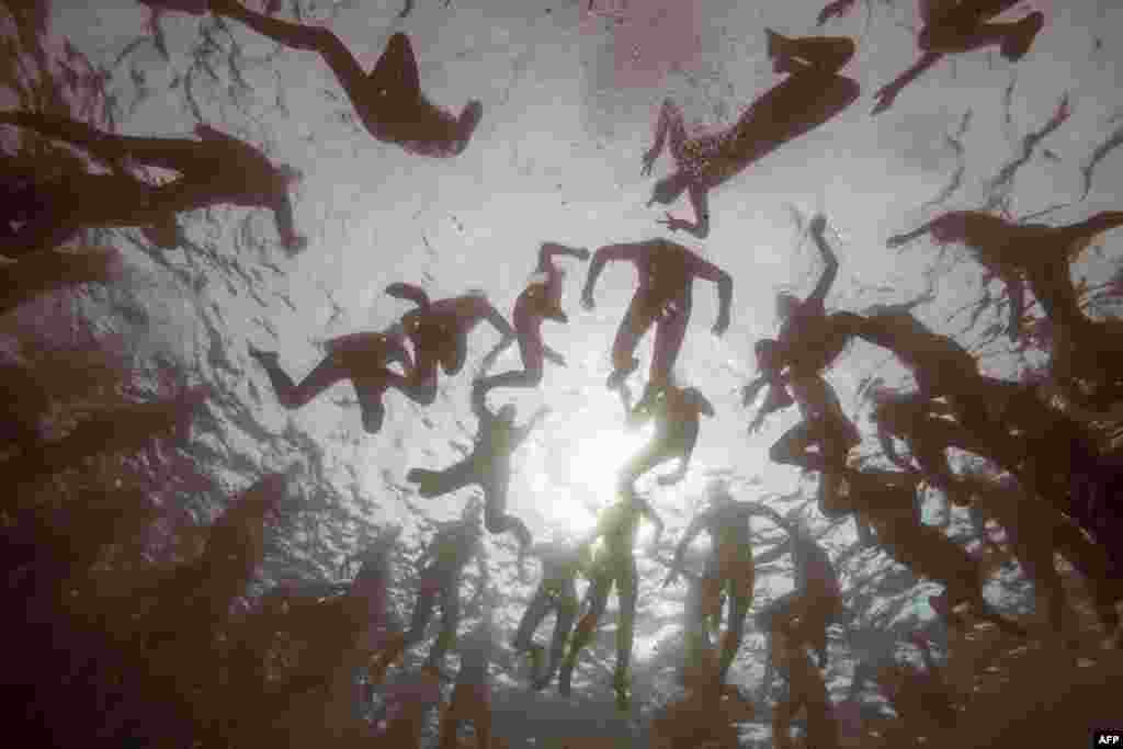 Swimmers wait for the start of the "Monte-Cristo challenge" ("Le Defi Monte-Cristo") swim event at the Chateau d'If off Marseille, southern France.