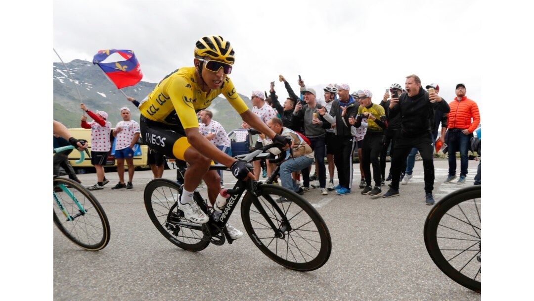 Colombia's Egan Bernal wearing the overall leader's yellow jersey climbs toward Val Thorens during the twentieth stage of the Tour de France, July 27, 2019.