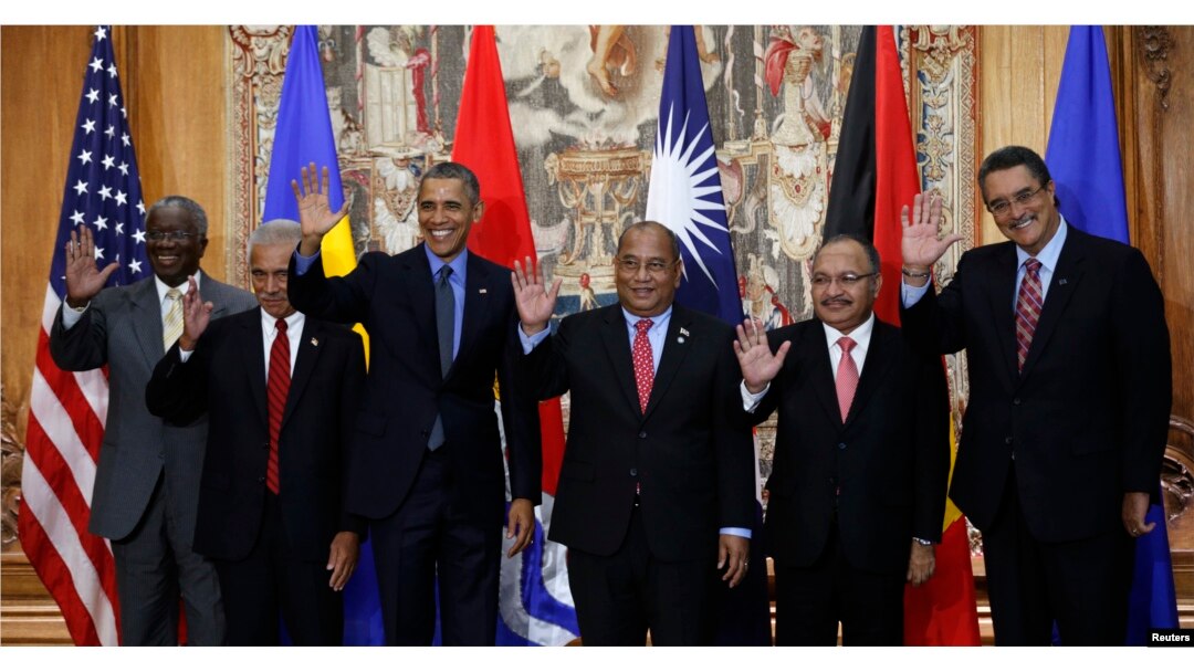U.S. President Barack Obama poses for a family photo with leaders of island nations under threat by rising sea levels during the World Climate Change Conference 2015 (COP21) in Paris, Dec. 1, 2015.