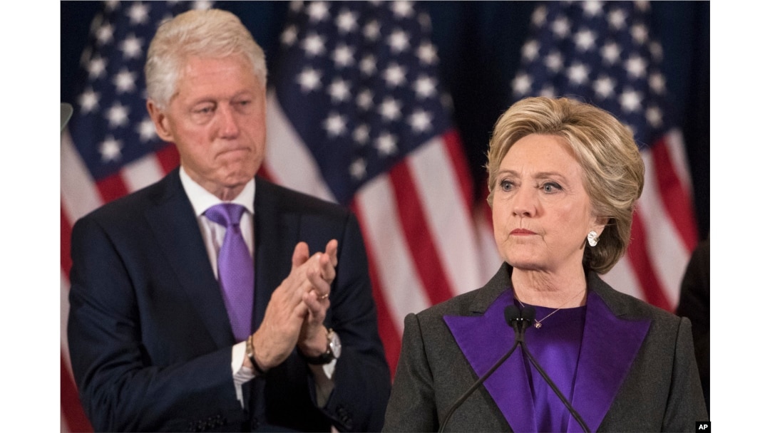 Former President Bill Clinton applauds as his wife, Democratic presidential candidate Hillary Clinton speaks in New York where she conceded her defeat to Republican Donald Trump after the hard-fought presidential election, Nov. 9, 2016.