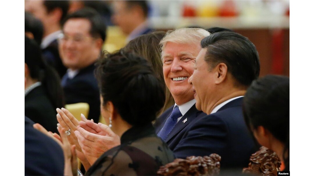 FILE - U.S. President Donald Trump and China's President Xi Jinping attend a state dinner at the Great Hall of the People in Beijing, Nov. 9, 2017.