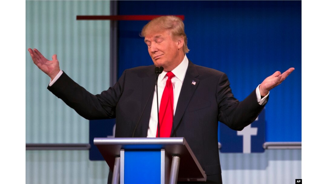 Republican presidential candidate Donald Trump gestures during the first Republican presidential debate, Cleveland IN, Aug. 6, 2015.