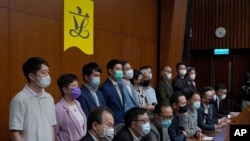 Hong Kong's pro-democracy legislators said at a press conference at the Legislative Council in Hong Kong, Nov. 9, 2020, that they would resign en masse if Beijing disqualifies any of them.