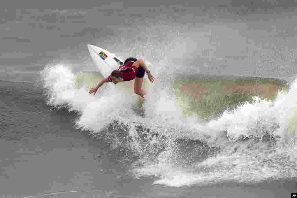 South Africa's Bianca Buitendag maneuvers on a wave during the quarterfinals of the women's surfing competition at the 2020 Summer Olympics, Tuesday, July 27, 2021, at Tsurigasaki beach in Ichinomiya, Japan. (AP Photo/Francisco Seco)