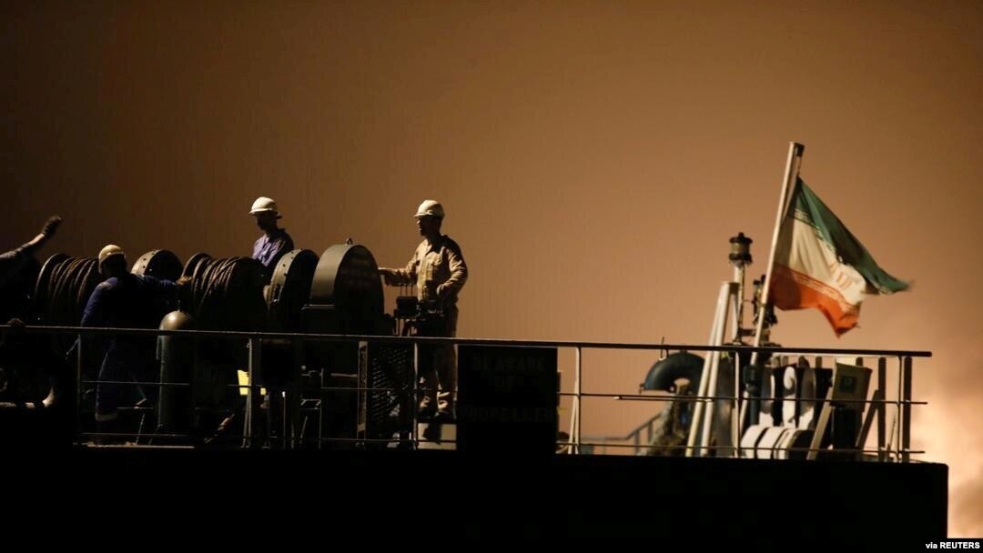 FILE - Crew of the Iranian tanker ship 'Fortune' are seen at the deck during the arrival at El Palito refinery in Puerto Cabello, Venezuela, May 25, 2020. (Miraflores Palace/Handout via Reuters)