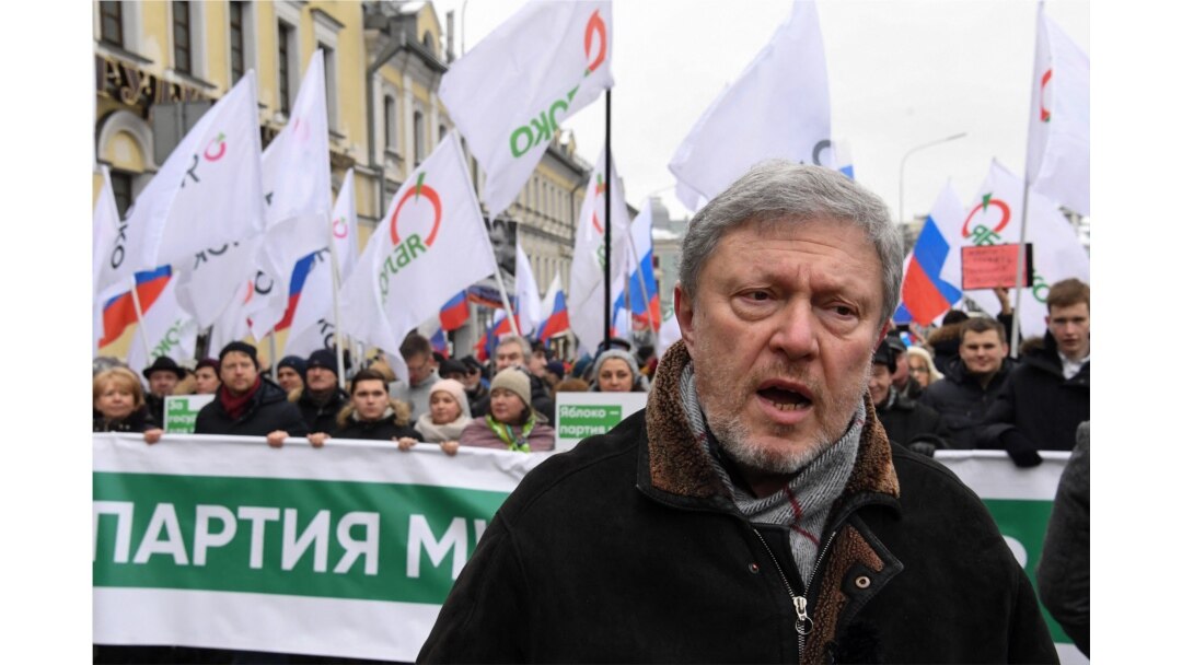 FILE - Liberal politician Grigory Yavlinsky participates in a march in memory of murdered Kremlin critic Boris Nemtsov, in central Moscow, Russia, Feb. 24, 2019.