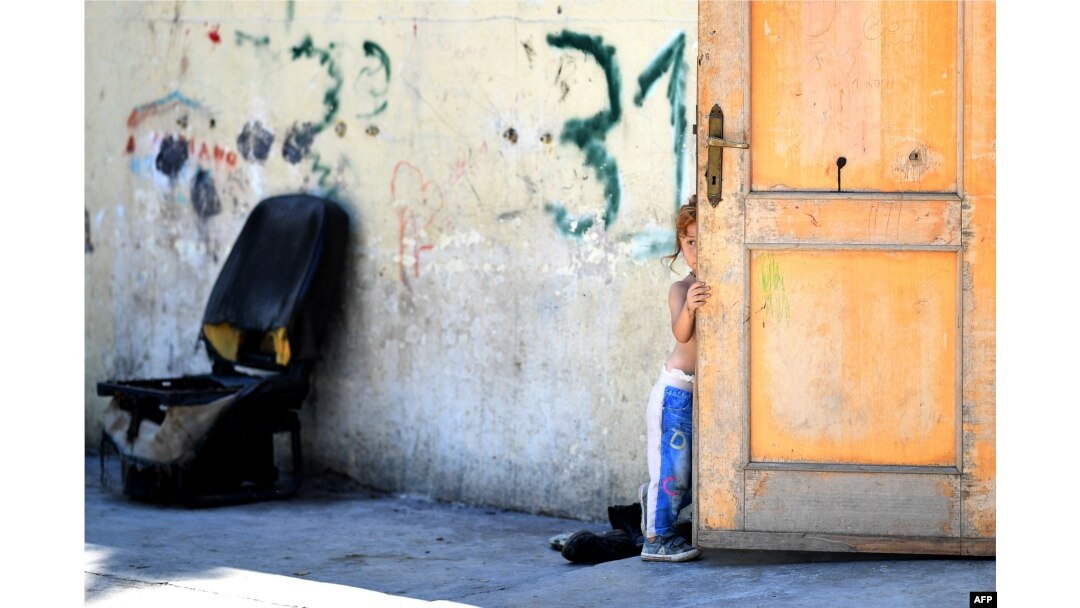 A girl, member of the Roma community, is pictured at the "River Village" Roma camp, managed by the Onlus Isola Verde association in Rome, Italy, jUNE 19, 2018.