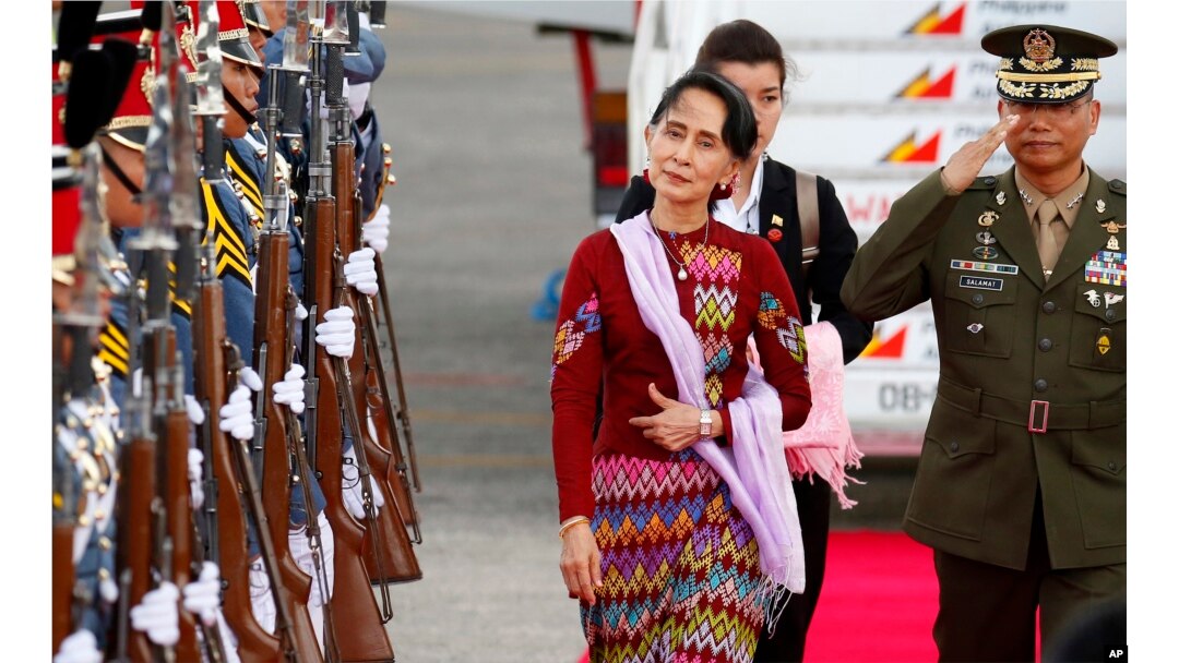 FILE - Myanmar leader Aung San Suu Kyi arrives at Clark International Airport, north of Manila, Philippines to attend the 31st ASEAN Summit and Related Summits in Manila, Nov. 11, 2017.