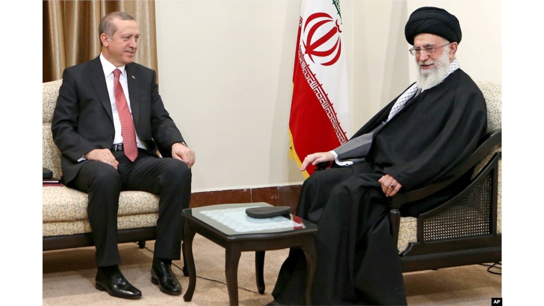 FILE - In this photo released by an official website of the Iranian Supreme Leader office, Supreme Leader Ayatollah Ali Khamenei, right, talks with Turkish President Recep Tayyip Erdogan during their meeting in Tehran, Iran, April 7, 2015.