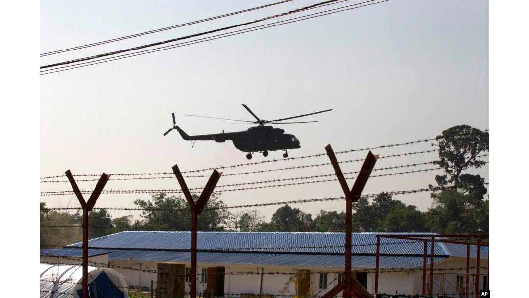 A helicopter carrying an advisory commission lands near newly-built repatriation camps prepared for Rohingya refugees expected to be returning from Bangladesh, Jan. 24, 2018, in Taungpyo, Myanmar.
