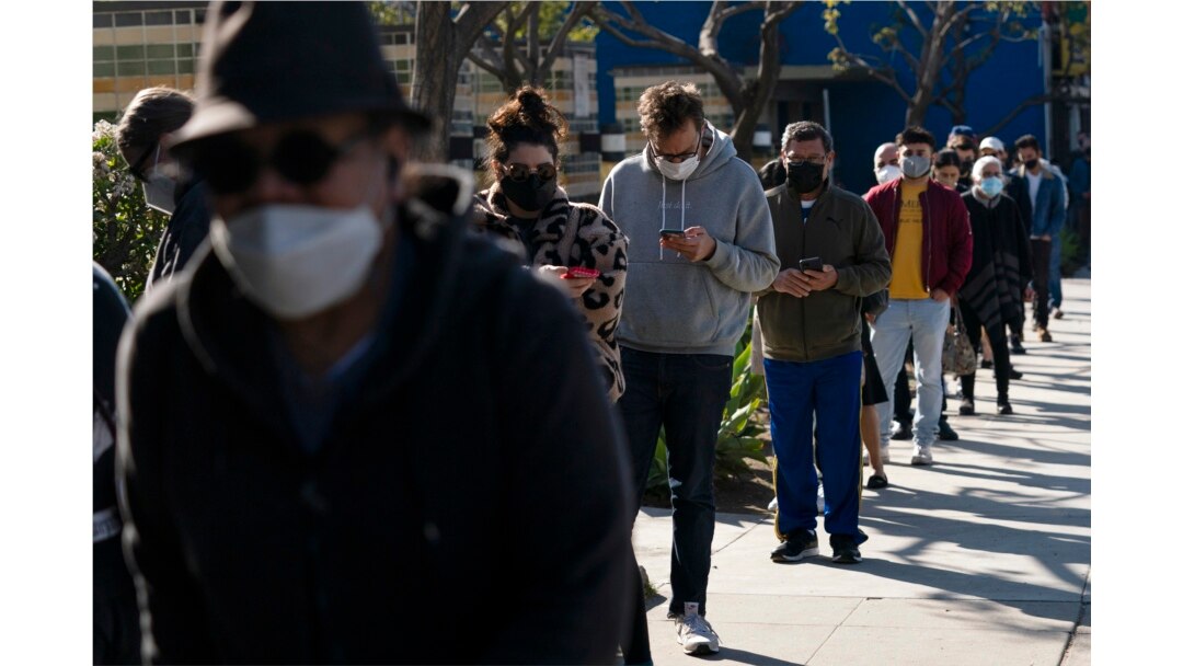 People wait in line for a COVID-19 test in Los Angeles, California, Jan. 4, 2022.