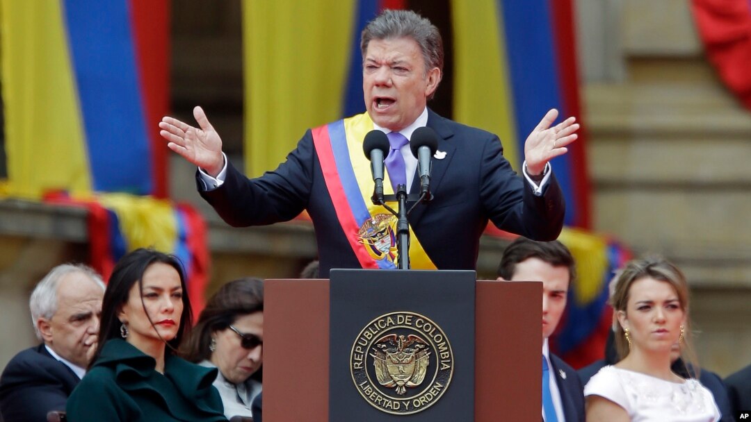 Wearing the presidential sash, newly sworn-in President Juan Manuel Santos, delivers his inaugural speech, in Bogota, Colombia, Aug. 7, 2014.