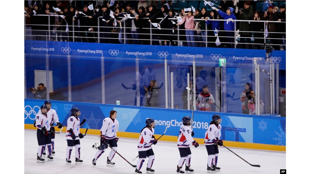 Fans cheer the combined Koreas team after the classification round of the women's hockey game against Sweden at the 2018 Winter Olympics in Gangneung, South Korea, Feb. 20, 2018. Sweden won 6-1.