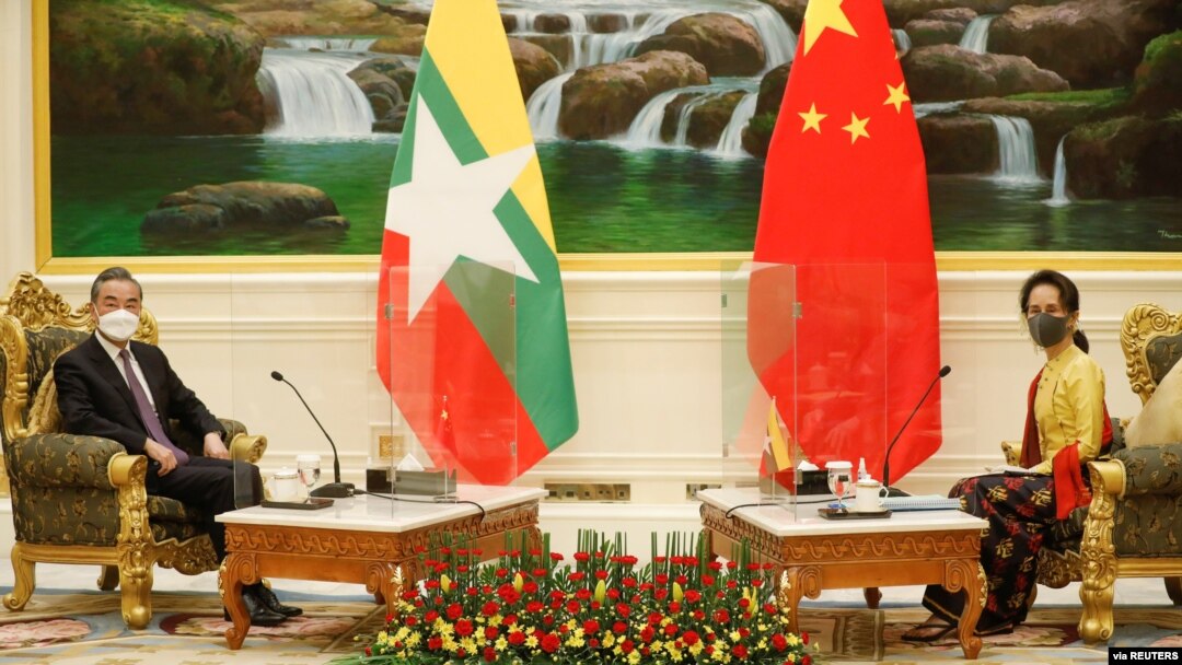 China's State Councillor and Foreign Minister Wang Yi is welcomed by and Myanmar's state counsellor Aung San Suu Kyi in Naypyitaw, Myanmar, Jan. 11, 2021.