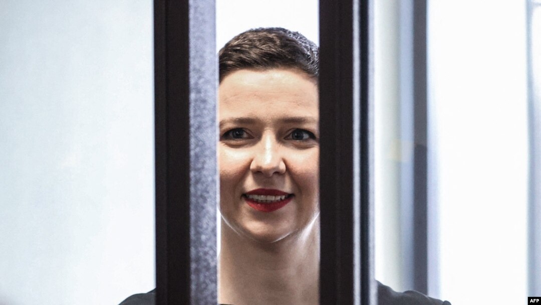 FILE - In this photo taken on Aug. 04, 2021, Maria Kolesnikova smiles inside the defendants' cage at the opening of her trial in Minsk.