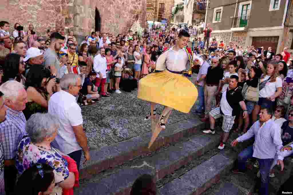 A dancer performs the whirling Dance of the Zancos on Saint Mary Magdalene&#39;s feast day in Anguiano, Spain.