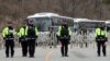 South Korean policemen and soldiers stand guard at a golf course owned by Lotte, where the U.S. Terminal High Altitude Area Defense (THAAD) system will be deployed, in Seongju, March 1, 2017. 