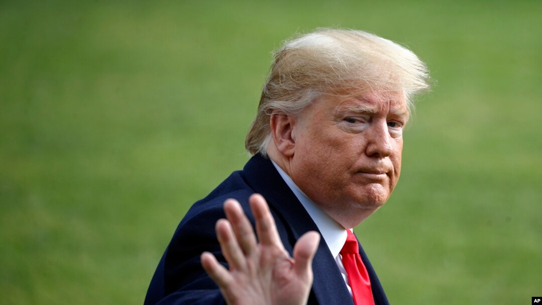 President Donald Trump waves as he walks to the Marine One helicopter after speaking to the media, Nov. 20, 2019, as he leaves the White House in Washington, en route to Texas. 