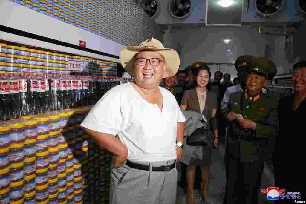 North Korean leader Kim Jong Un visits a factory in this undated photo released by North Korea's Korean Central News Agency (KCNA) on Aug. 7, 2018.