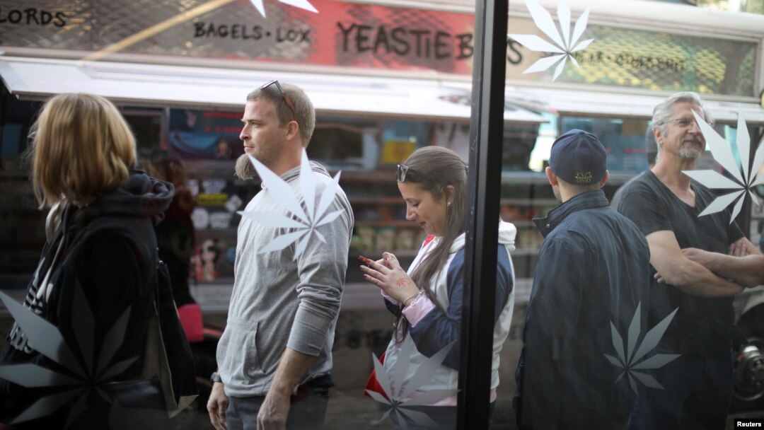 Customers queue for recreational marijuana outside the MedMen store in West Hollywood, California, Jan. 2, 2018. 