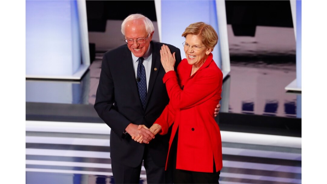 FILE - Sen. Bernie Sanders, I-Vt., and Sen. Elizabeth Warren, D-Mass., participate in the first of two Democratic presidential primary debates hosted by CNN, July 30, 2019, in the Fox Theatre in Detroit.