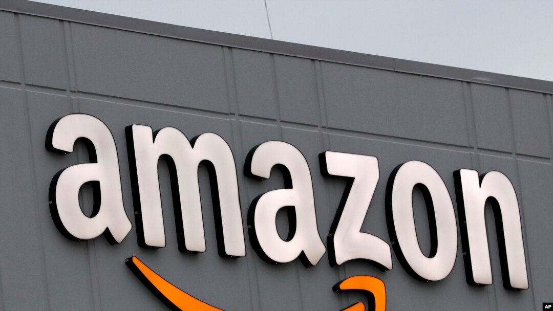 FILE - A sign is seen on the facade of an Amazon fulfillment center, in New York City, March 19, 2020. Most of Amazon's 60 plus fulfillment centers in India are shut and the U.S.-based company is in talks with state authorities to try to reopen them.