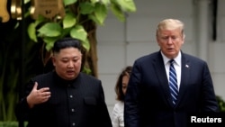 金正恩與特朗普。(資料圖片)
