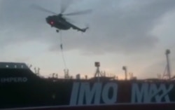 FILE - This image grab taken from a video provided by Iran's Revolutionary Guard official website via SEPAH News on July 20, 2019, allegedly shows Revolutionary Guard Corps boarding the British-flagged tanker Stena Impero in the Strait of Hormuz.