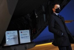 FILE - Slovak Prime Minister Igor Matovic wears a face mask as he gives a press statement at the International Airport in Kosice, Slovakia, March 1, 2021.