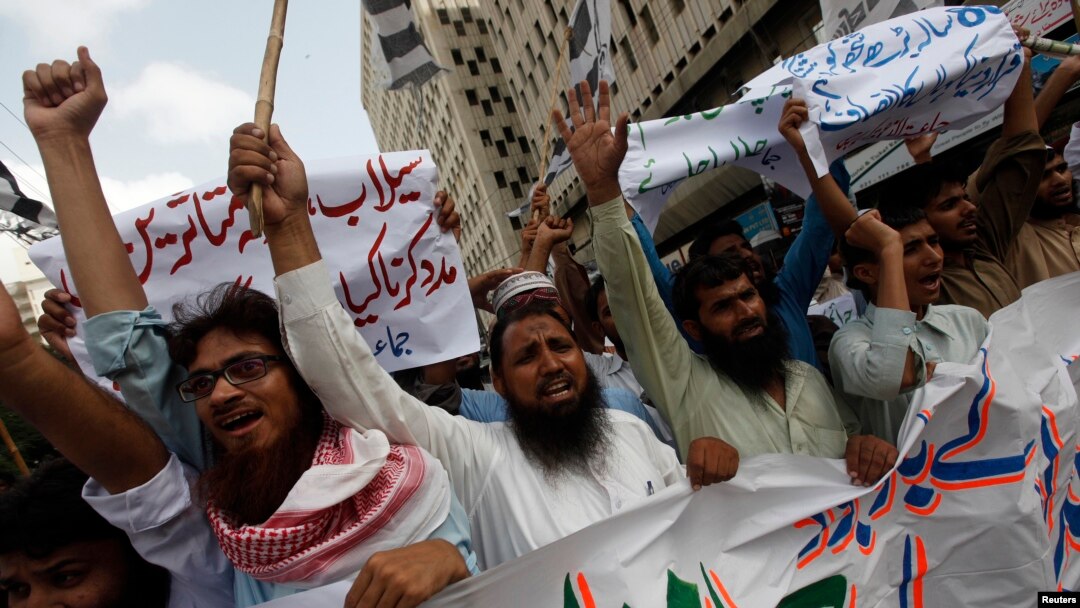 FILE - Supporters of the Jamaat-ud-Dawa organization chant slogans during a protest rally in Karachi, June 27, 2014. 