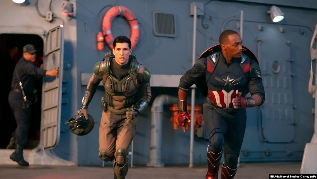 This image released by Disney shows Danny Ramirez, left, and Anthony Mackie in a scene from Marvel Studios' "Captain America: Brave New World." 