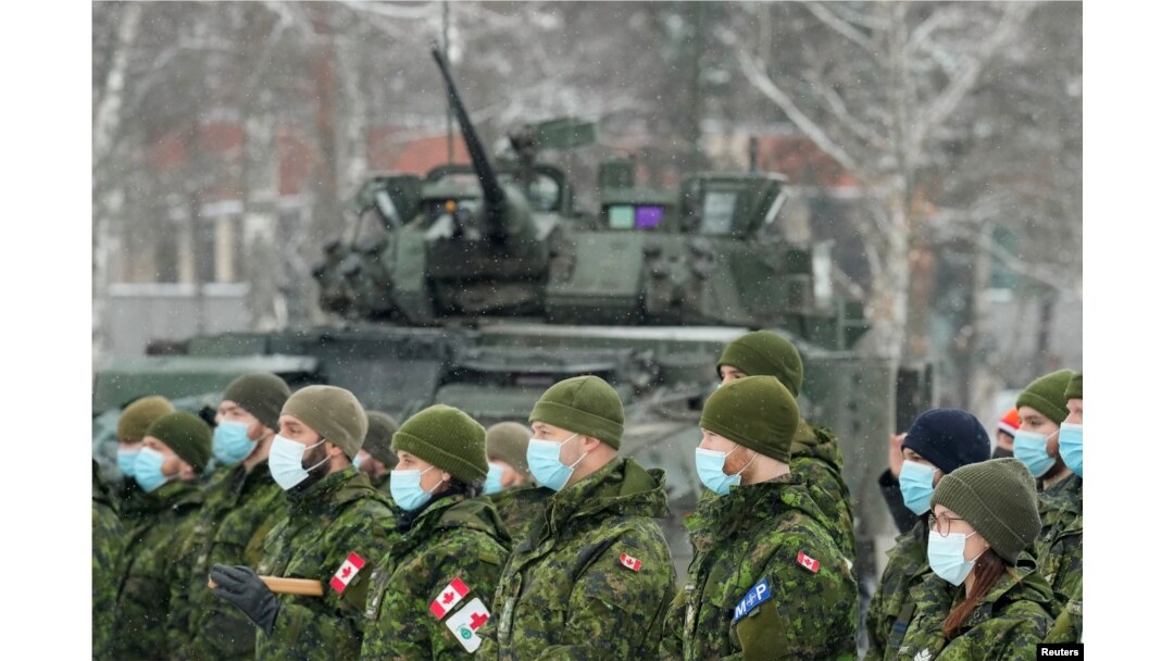 Canadian troops of NATO enhanced Forward Presence battle group attend a meeting with Canadian Defence Minister Anita Anand, in Adazi, Latvia, Feb. 3, 2022.