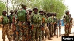 Nigerian soldiers are seen on the outskirts of Maiduguri in the north-eastern state of Borno in this May 13, 2013, file photo.