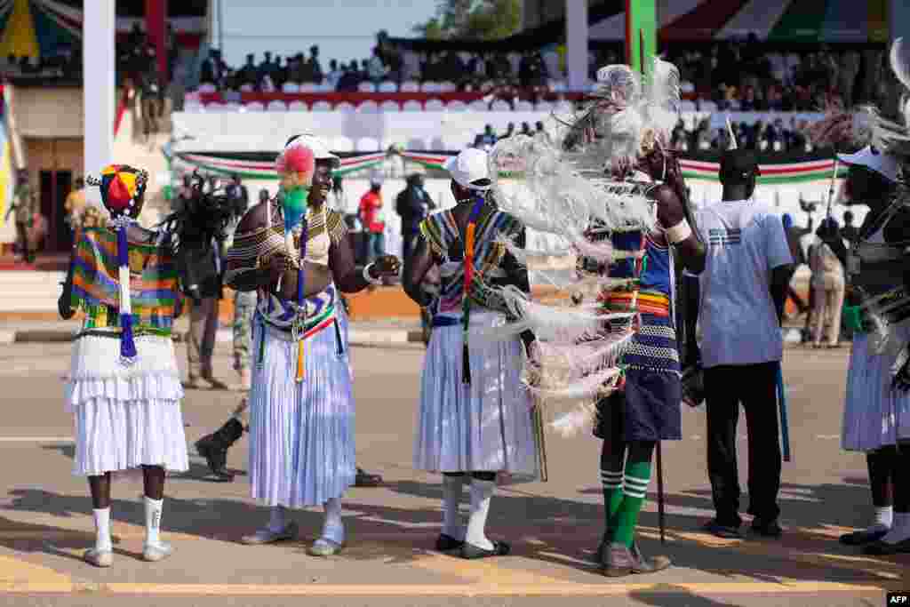 South Sudanese dance and wave flags during celebrations marking three years of Independence at a stadium in Juba, July 9, 2014.